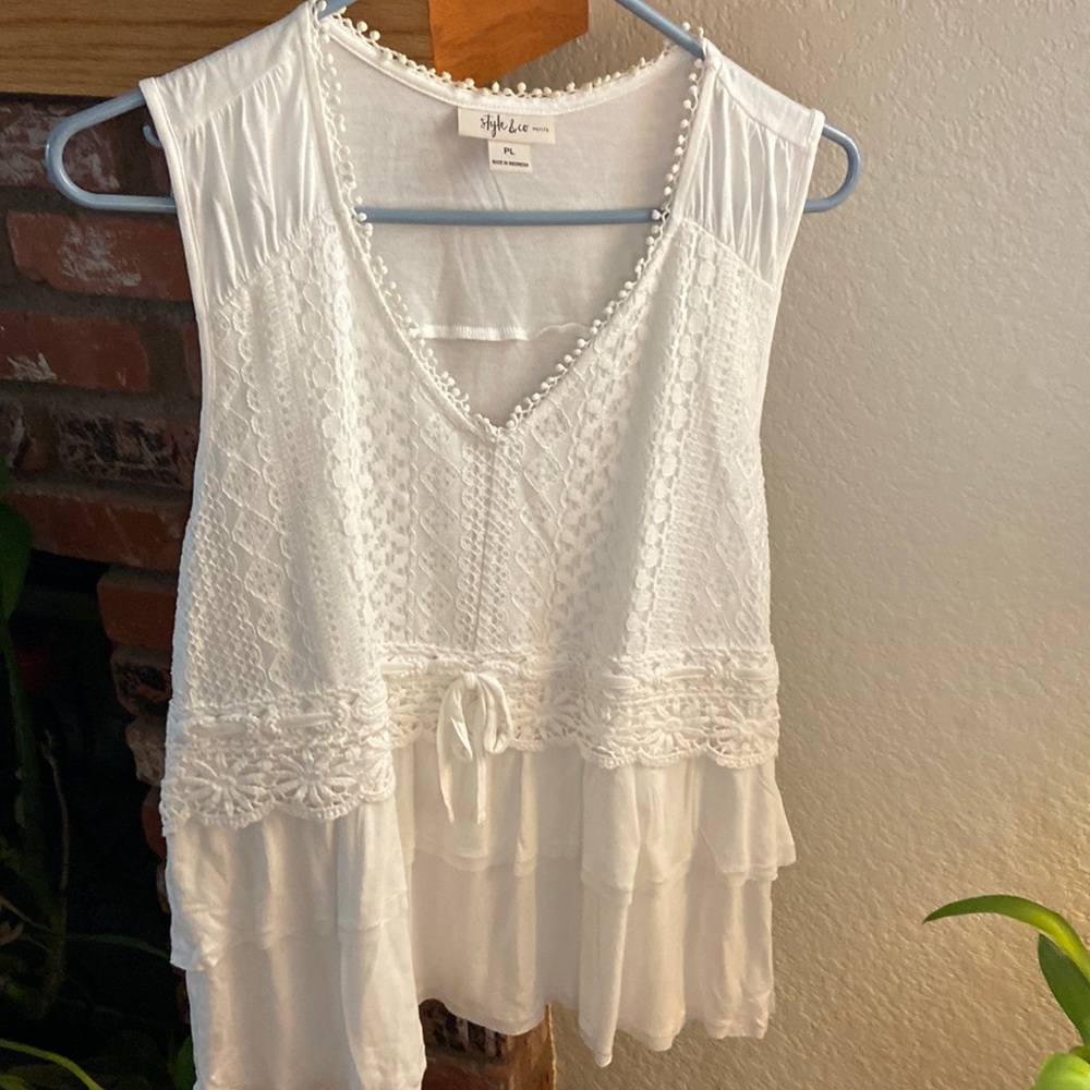 Style &Co petit large white blouse. It is decorated with layers of lace.